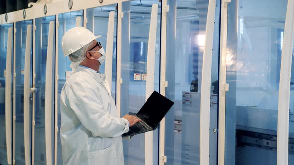 Modern Plant Equipment is Getting Observed By a Male Expert alt