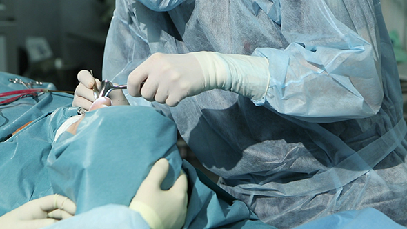 Surgeon Hands During Operation In Surgery Room