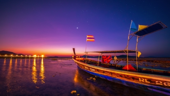 Dawn In The Sea Against The Backdrop Of a Fishing Boat In Phuket alt