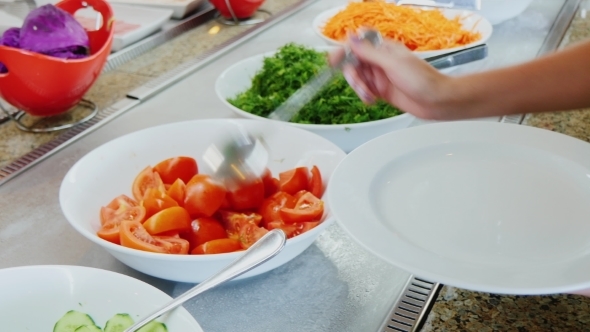 Take The Chopped Tomatoes On The Plate In a Cafe With Self-service alt