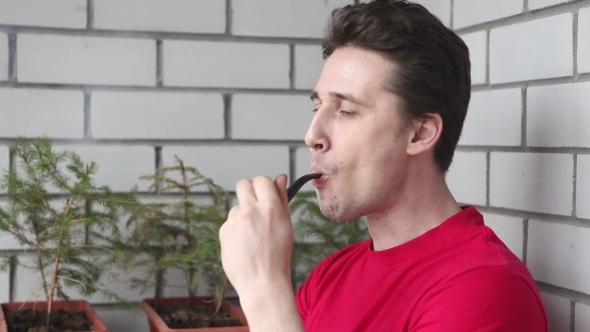 Man Smoking a Pipe  alt