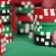 Red Dice And Casino Chips In Fingers On Green Table - VideoHive Item for Sale
