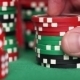 Red Dice And Casino Chips In Fingers On Green Table - VideoHive Item for Sale
