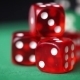 Red Dice And Casino Chips Rotation On Green Table - VideoHive Item for Sale