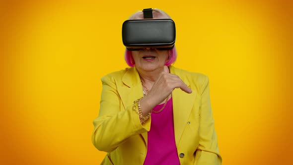 Senior Woman Using Virtual Reality VR App Headset Helmet to Play Simulation 3D Video Game Drawing alt