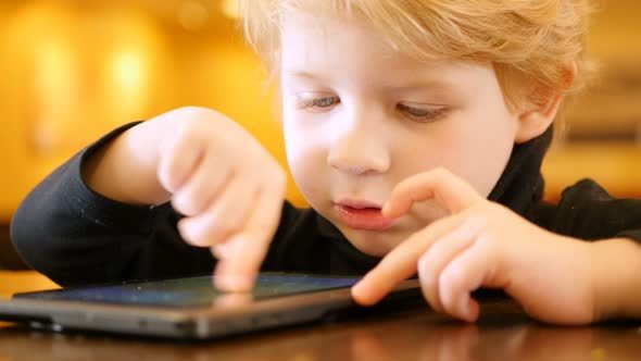Boy Playing With Digital Tablet
