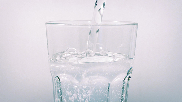 Sparkling Water Poured Into Rotating Glass, Stock Footage | VideoHive