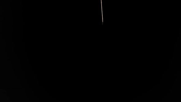 Egg falls on a black background slow motion alt