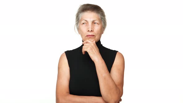 Senior Serious Woman Touching Her Chin Thinking Hard Finally Figure Out Recall Something Gesturing alt