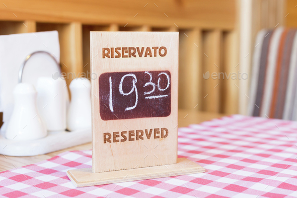 Board with reservation information in restaurant