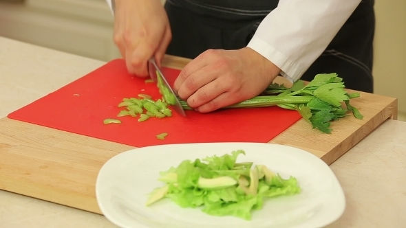 Chef Slicing Celery For Salad alt