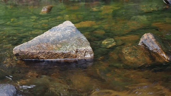 Stream Flowing Between Rocks 