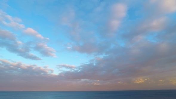 Cloudy Sunset Sky over the Sea. alt