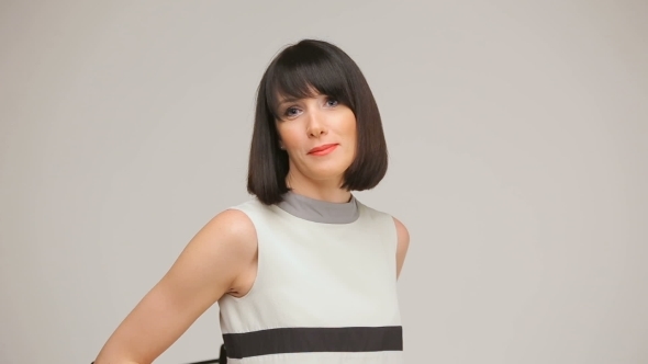 Young Brunette Smiling And Dancing