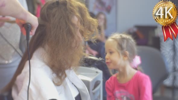 Two Stylists Hairdressers With Gofre Irons Making alt