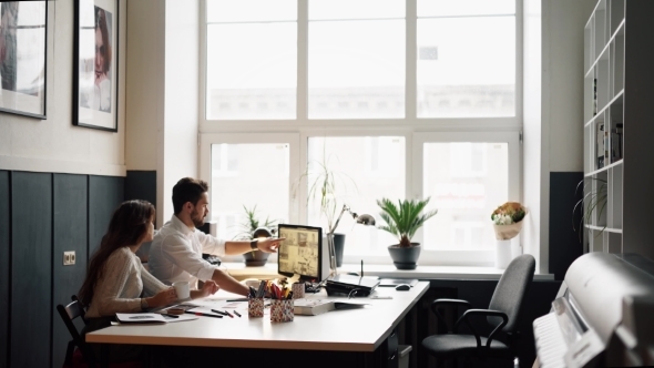 Team Of Young Architects Discussing Housing Project alt