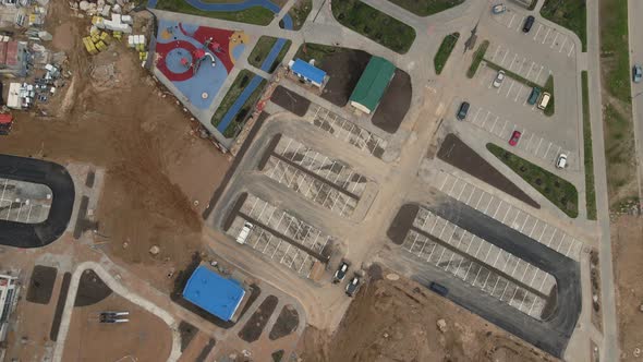 Flight Over The Construction Site. Filmed With The Camera Down.