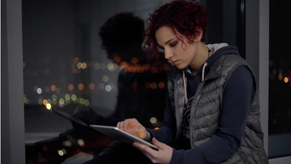 The Teenager Playing on a Tablet alt