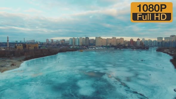 Flying on a Drone Over the Ice to the City