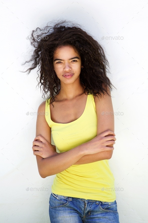 Attractive mixed race female model with curly hair Stock Photo by  mimagephotography