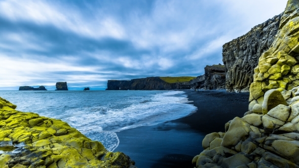 . Waves Breaking On The Black Sand Beach On a Background Of Mountain Lava. Reynisdrangar Beach alt