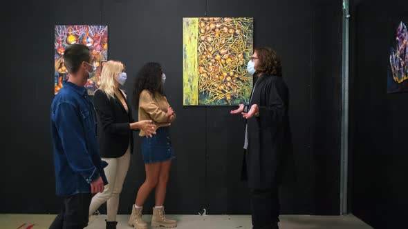 Interested in Art Young People Listening to the Art Guide at the Exhibition alt