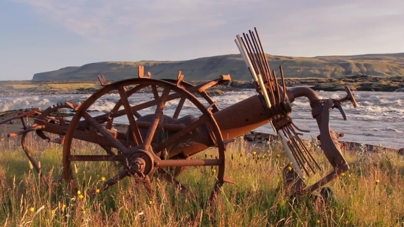 Old Plow On a Backgraund Ov Mountain River In Iceland