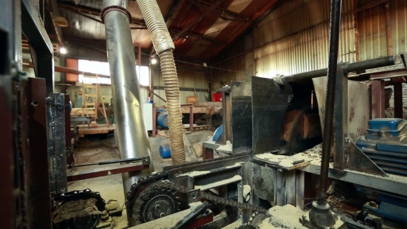Woodworking Plant. View Of Sawing Log Into Boards
