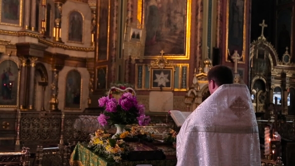 The Priest Prays In Church