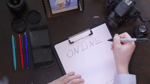 A Man Writes a Pen On Paper Word Online