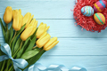Easter background, eggs, yellow tulips on wood - PhotoDune Item for Sale