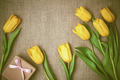 Mothers Day background. Tulips, gift on sackcloth - PhotoDune Item for Sale