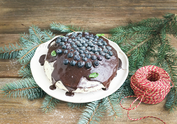 Christmas chocolate celebration cake with chocolate ganache, cre - Stock Photo - Images