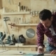 Carpenter Draws The Project In a Carpentry Workshop - VideoHive Item for Sale