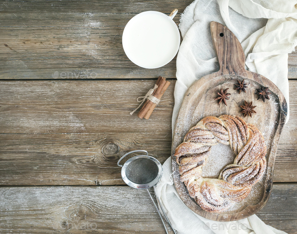 Village style breakfast set: sweet cinnamon ring bread and a cup - Stock Photo - Images