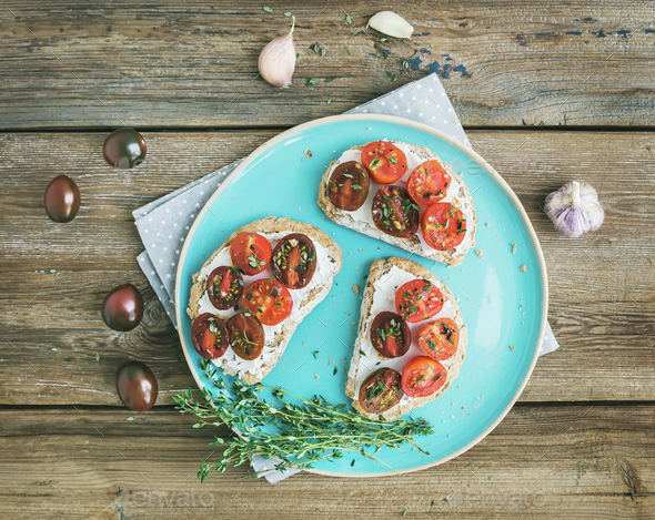 Rustic breakfast set of sandwiches with soft cream-cheese, cherr - Stock Photo - Images