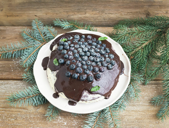 Christmas chocolate cake with chocolate ganache, cream-cheese fi - Stock Photo - Images