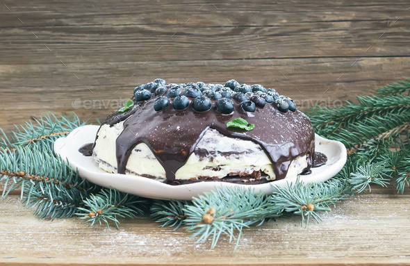 Christmas chocolate cake with chocolate ganache, cream-cheese fi - Stock Photo - Images