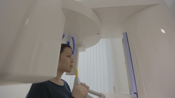 Examination Of The Patient By Using Panoramic And Cephalometric X-Ray Scanner 