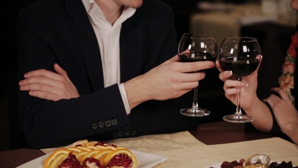 Happy Couple Have a Romantic Date In a Fine Dining Restaurant They Drink Wine 