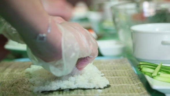 Sushi Master Puts Rice On The Nori