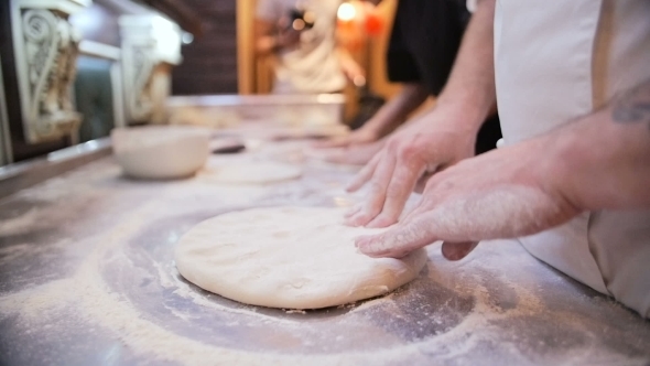 Chef Tossing Pizza Dough