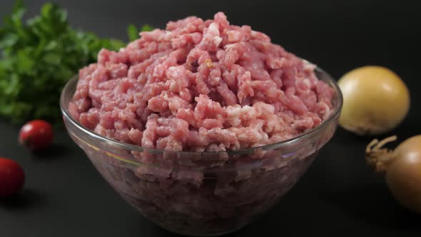 Close Up of Human Hands Put Glass Bowl with Minced Veal Chicken and Pork