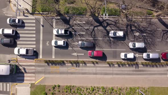Aerial top down of cars and buses driving on separate lanes, Buenos Aires Metrobus alt