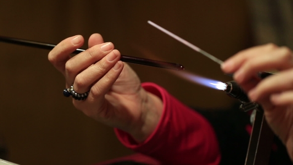 Women's Hands Make Glass Beads