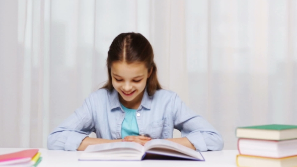 Happy School Girl Reading Book Or Textbook At Home, Stock Footage ...