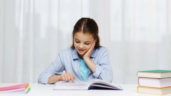 Happy School Girl Reading Book Or Textbook At Home, Stock Footage ...