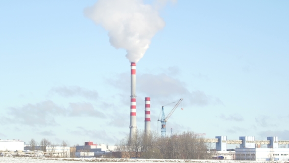 Chimney In Winter Smoke Coming From The Chimney.