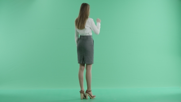 Business Woman And Touchscreen Technology On a Green Screen alt
