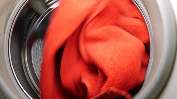 Washing Drying Machine With Red Towel In Laundry